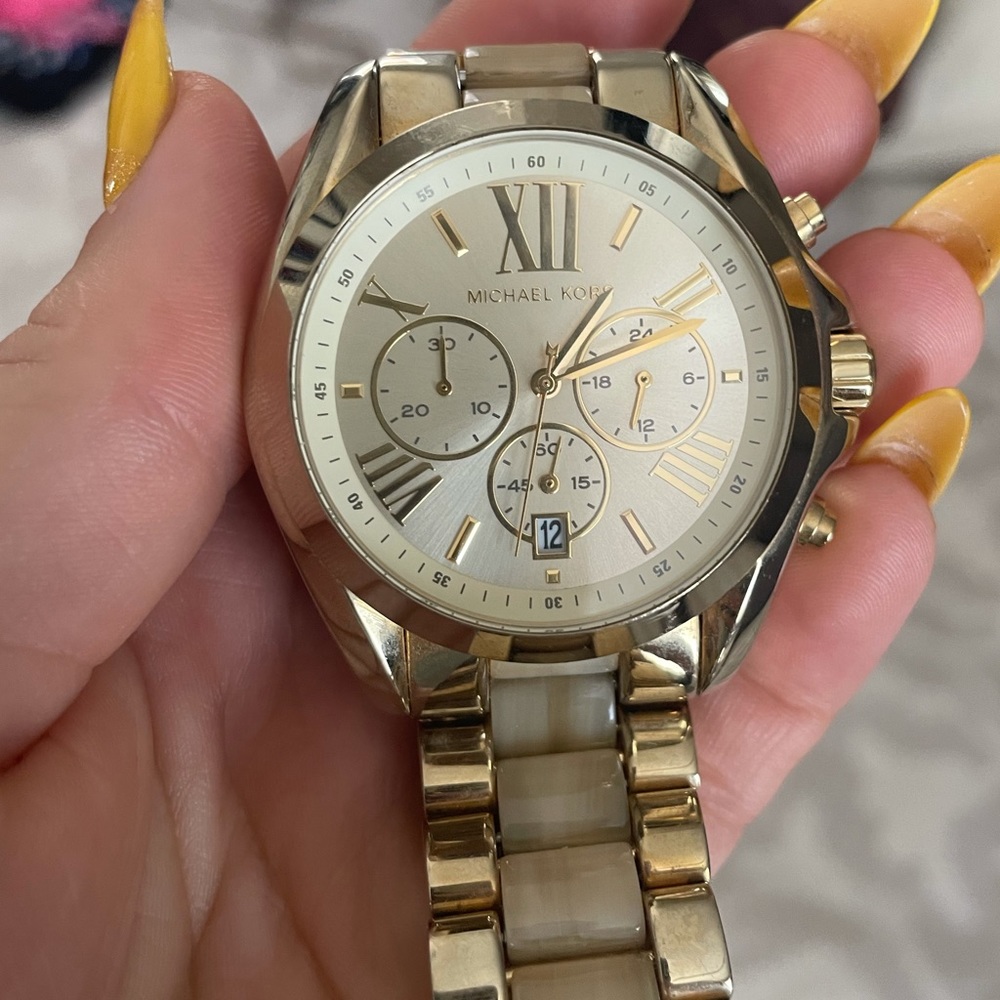 MK gold tone watch. New battery.
